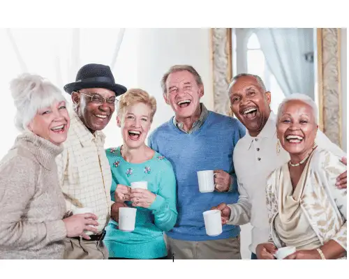 A group of happy old students in an online tuition event